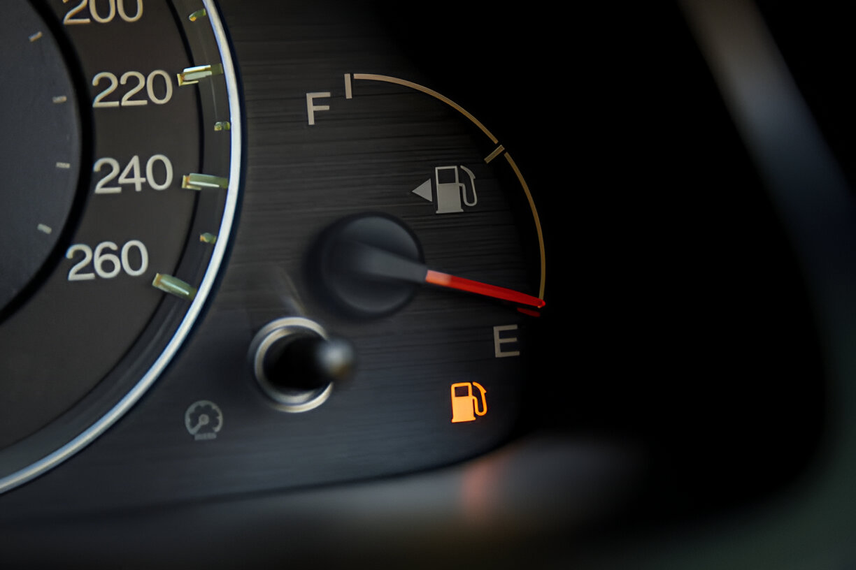 Empty fuel warning light in car dashboard